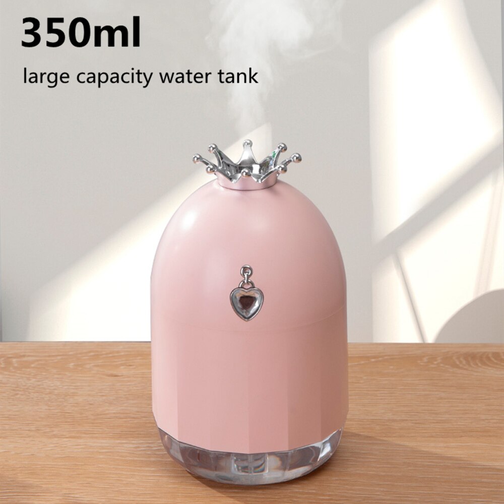 Humidificador de siete colores, pequeño producto nuevo y creativo, suplemento de agua, silenciador de corona, electrodomésticos con pulverizador. 