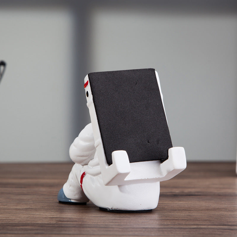 Soporte para teléfono móvil de astronauta Simple, soporte de escritorio para estudiantes, soporte para teléfono móvil con astronauta, regalo creativo, decoración de escritorio pequeña